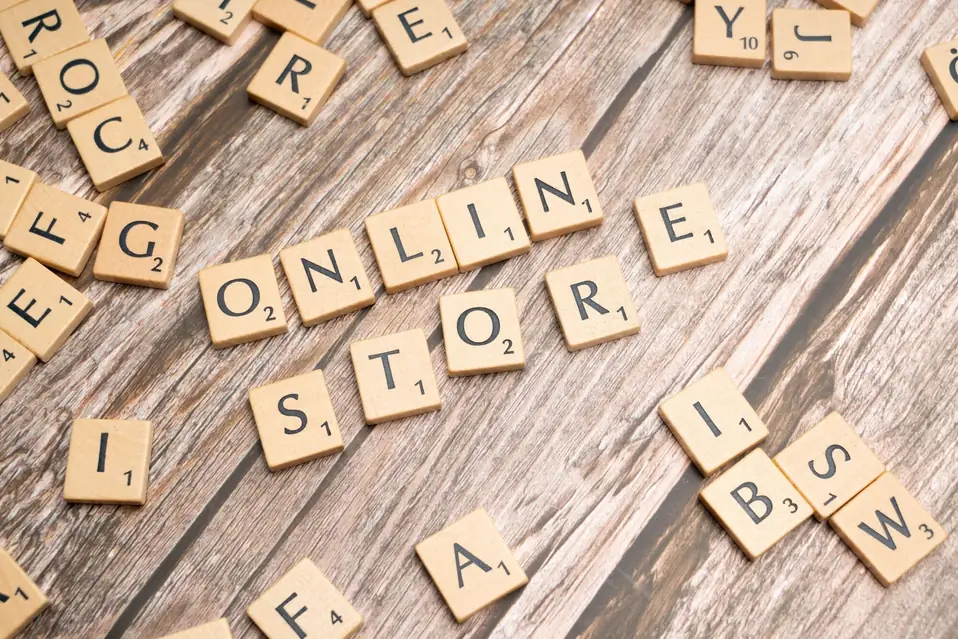 Shopify merchant reviewing Markets catalog settings and storefront cache behaviour on a laptop after splitting international and domestic catalogues