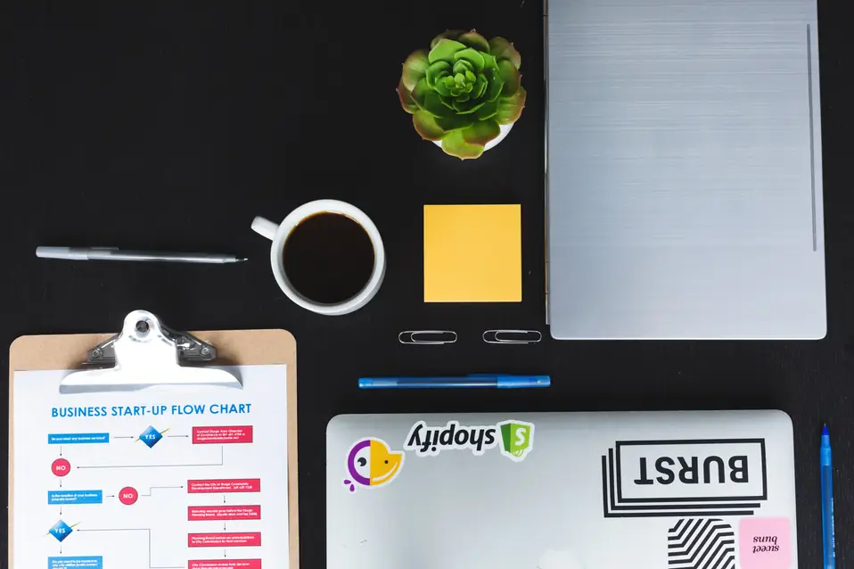 Shopify merchant reviewing revenue plateau and ecommerce growth metrics on a laptop