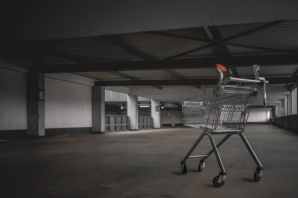 Shopify merchant reviewing checkout abandonment analytics on a laptop with funnel metrics showing add to cart and checkout starts but zero completed purchases